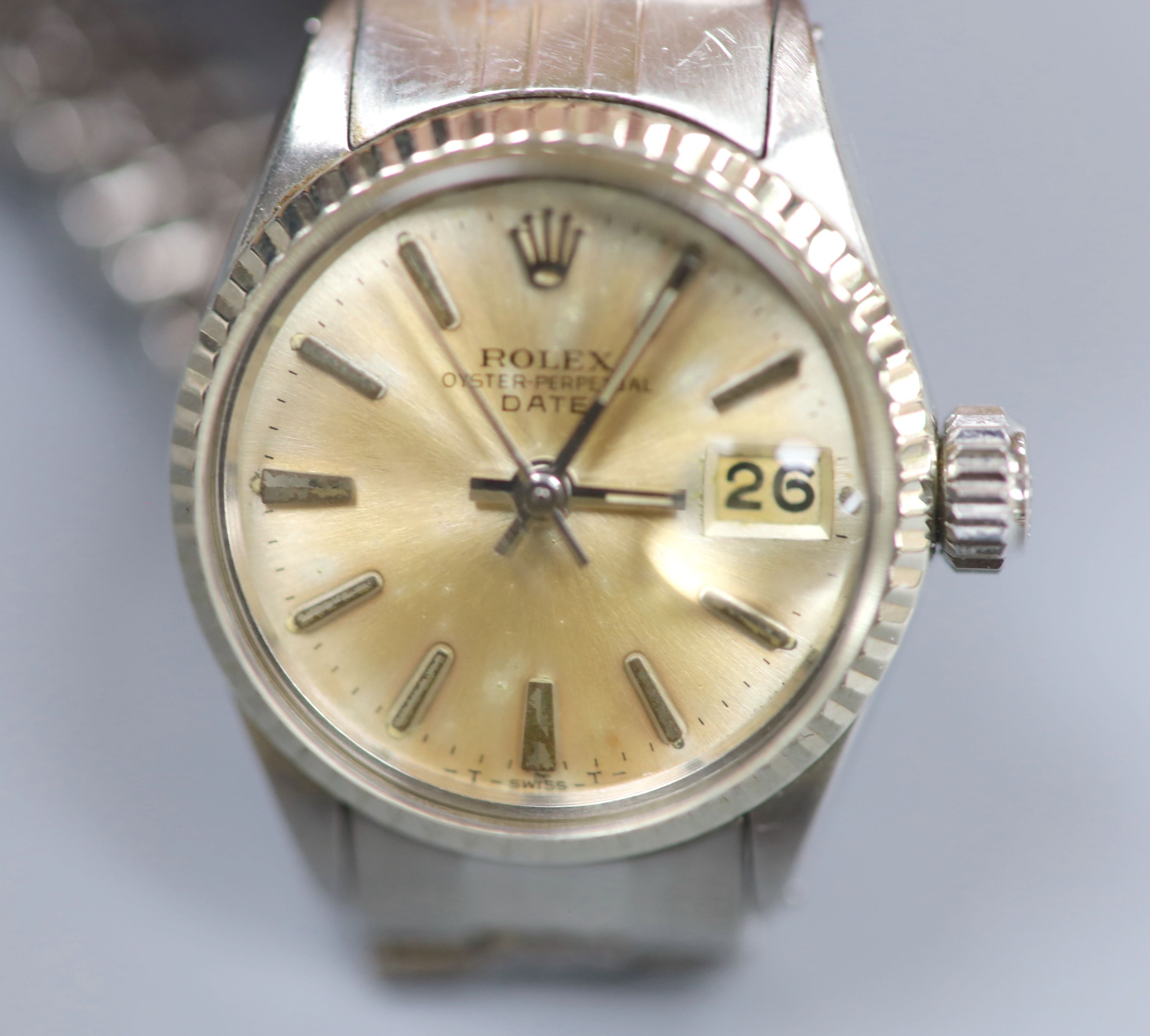 A ladys 1960s stainless steel Rolex Oyster Perpetual Date wrist watch, on Rolex bracelet, model no. 6517, serial no.1529297,
